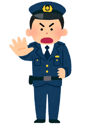 注意する警察官